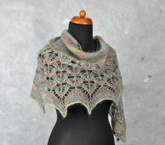 a knitted shawl on a mannequin head