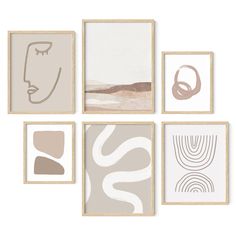 an assortment of framed art pieces in various shapes and sizes, arranged on a wall