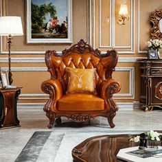 a living room filled with lots of furniture next to a wall mounted painting on the wall