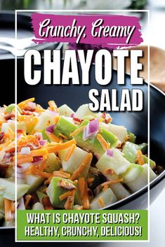 a black bowl filled with chopped vegetables on top of a table