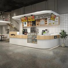 the interior of a fast food restaurant with white tile walls and flooring, along with an open counter