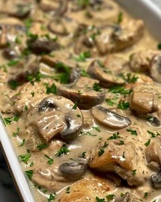 a casserole dish with chicken and mushrooms covered in gravy