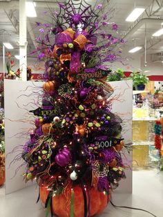 a christmas tree with purple and orange decorations