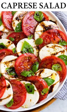 caprese salad with mozzarella, tomatoes and basil in a white bowl