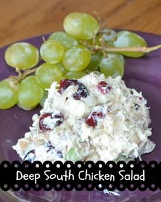 grapes and chicken salad on a purple plate