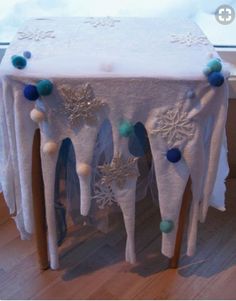 the table is covered with snowflakes and decorations