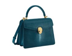 Serpenti Forever Medium Top Handle Bag In Laguna Blue Galuchat Skin With Teal Topaz Bluish Green Nappa Leather Sides And Black Nappa Leather Lining. Captivating Snakehead Magnetic Closure In Gold-plated Brass Embellished With Diamond-cut Engraving On The Scales, And Black Onyx Eyes. Serpenti Forever Bag, Onyx Eyes, Laguna Blue, Metal Tags, Top Handle Bags, Designer Totes, Bluish Green, Tote Purse