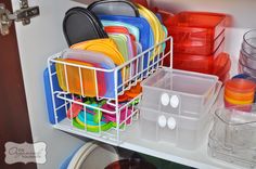 there are many plates and bowls in the dish rack