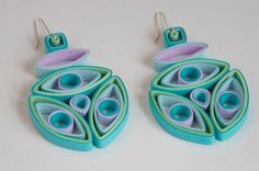 two pairs of earrings made out of paper