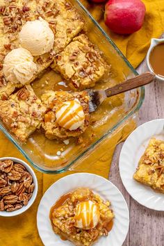 an apple cobbler with ice cream and pecans on the side next to it