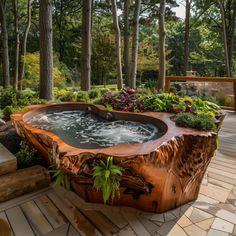 an outdoor hot tub surrounded by trees and plants