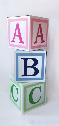 three blocks with letters stacked on top of each other