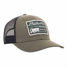 A green American made trucker hat with Duckworth patch on it. Trucker Snapback Hat With Flat Bill, Trucker Hat For Camping, Trucker 5-panel Hat For Camping, Trucker 5-panel Camping Hat, Trucker Hat With Logo Patch And Curved Bill, Trucker Baseball Cap With Flat Brim For Camping, Trucker Style Snapback Baseball Cap, Trucker Hat With Curved Brim And Logo Patch, Trucker Baseball Cap With Curved Brim