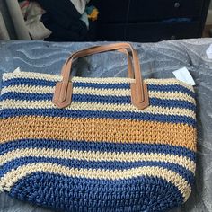 This Is A Mia And Tess Woven Shoulder Tote. The Color It Comes In Is Called “Natural”, And Has Beautiful Woven Blue, Gold And Yellow! The Leather Straps Are Sturdy And Comfortable. There Is One Pocket On The Inside But The Rest Is All Open So You Can Store As Much Or As Little As You Like. The Top And Can Also Zip Closed! This Is New With Tags! Blue Summer Bags For Day Out, Blue Summer Bag For Day Out, Blue Bags For Summer Day Out, Blue Beach Bag For Spring, Blue Summer Beach Bag For Spring, Spring Blue Bag With Braided Handles, Blue Spring Bags With Braided Handles, Spring Beach Bags In Blue, Blue Straw Bag For Spring Beach Outings