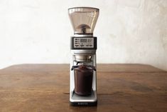 an espresso machine on a wooden table