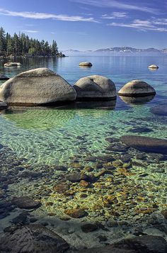 some rocks are in the water and there is no image on this page to describe