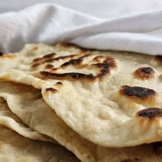 several flat breads are stacked on top of each other