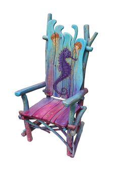 a colorful wooden chair with an image of a sea horse on it