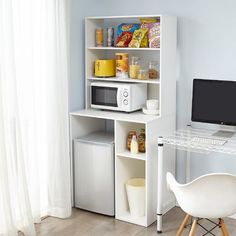 a white desk with a computer on top of it