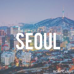 the words seoul over a cityscape with mountains in the background