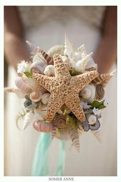 a starfish bouquet with seashells and flowers