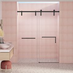 a bathroom with pink walls and tile flooring