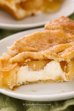 a slice of pie sitting on top of a white plate next to another piece of pie