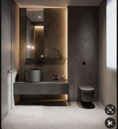 a bathroom with a toilet, sink and mirror