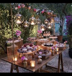 a table topped with lots of cakes and desserts