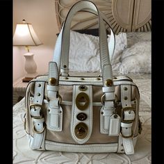 This Coach Legacy Lily Bag Is Rareand In This Color, Hard To Findthis Is The Medium Size Lily. Has White Patent Leather And A Tan Signature Woven Material Outside. Has Two Large Zip Sections Plus Two Outside Pockets, This Is Not A Small Bag. The Bad Is In Great Vintage Condition, There Are Just A Couple Blemishes Please See Pic’s. The Bag Is 12”L X 10 1/2”H X 4”D. This Is A Great Bag! Lily Bag, Coach Legacy, Medium Size, Small Bag, Coach Bags, Patent Leather, Satchel, Bag Lady, Lily