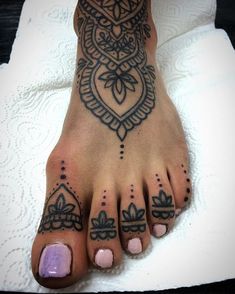 a person with some tattoos on their feet