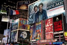 the times square in new york city is lit up with billboards and advertisements for movies