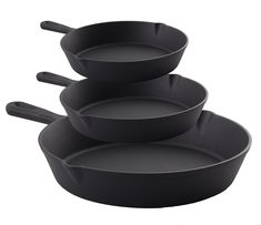 three black pans stacked on top of each other