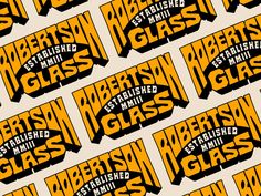 an orange and black pattern with the words glass on it's back side, in different font styles