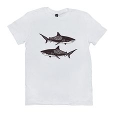 two black and white shark t - shirts on a white shirt with an image of two sharks