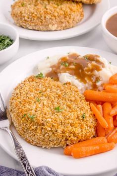 two white plates topped with meat and veggies next to gravy on top of mashed potatoes