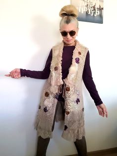 I designed and constructed this M size beige sleeveless cardigan.This boho chic vest can be worn every day or when you want to feel good and one of a kind.Length - 89 cm/ 35 inches Bust - 102 cm/ 40 inchesHips - 107 cm/ 42 inchesI used beige knit cotton blend sleeveless cardigan, laces,velvet,tulle,Preciosa glass beads, sequins..This embroidered fleece jacket is NOT STRETCHY !!!! Floral Spring Cardigan M Embroidered Knit Vest Machine wash on a gentle or wool program!!!!All my items are ready to ship within 1-3 working days. You will receive them in a special box or an envelope/protected with bubble wrap material inside/ of the Bulgarian National Post.I also add a special gift bag, handmade by me.This knit casual cardigan jacket is exclusive, one of a kind, because I don`t make more than on Bohemian Spring Vest For Layering, Bohemian Vest For Spring Layering, Sleeveless Beige Cardigan For Fall, Beige Sleeveless Cardigan For Fall, Bohemian Fall Vest Outerwear, Bohemian Sleeveless Embroidered Outerwear, Bohemian Vest For Fall Layering, Bohemian Vest Outerwear For Fall, Fitted Beige Bohemian Vest