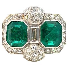 Stunning Art Deco Platinum Ring featuring exquisite Colombian Emeralds Design: Timeless Art Deco elegance Gems: 2 vivid green emeralds, each weighing approximately 1.60 carats Certification: Comes with a GRS Gemological Certificate (GRS2024-047503) confirming the emeralds are Vivid Green with Minor Oil Treatment This exquisite piece is a perfect blend of vintage charm and modern sophistication. Ideal for collectors and connoisseurs of fine jewelry. Rings Art Deco, Bijoux Art Deco, Emerald Ring Engagement Diamond, Columbian Emeralds, High Jewelry Ring, Wedding Ring For Her, Estate Rings, Platinum Diamond Rings, Mid Century Jewelry