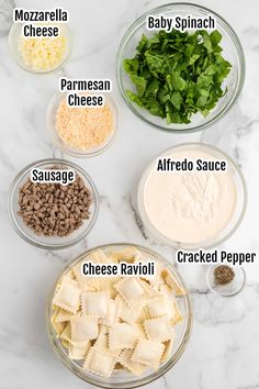 the ingredients to make ravioli in bowls on a marble counter top, including parmesan cheese, parmesan sauce, and ground pepper