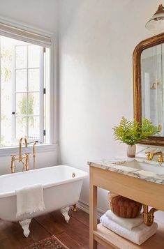 the bathroom is clean and ready to be used as a bathtub, sink, and window