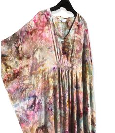 "One of a kind caftan, individually ice dyed using shibori tie techniques. Gauzy lightweight rayon is ethereal and drapey. Fabric is semi-sheer. Soft v-neck with smocking detail at front & back to add shape. Fluttery side seams. Super light and packable- perfect for travel, or for a WFH comfy dress. Flowy and voluminous but with enough shape that it doesn't look sloppy. Measurements- One Size Fits Many. Chest 28\" flat, Center Front Length 55\", Center Back Length 58\". You will receive the Bohemian Tie Dye V-neck Kaftan, Bohemian Tie-dye V-neck Kaftan, Flowy Tie Dye Kaftan With Natural Dye, Flowy Tie Dye Kaftan Tunic, Tie Dye Flowy Tunic Kaftan, Flowy Spring Kaftan With Natural Dye, Flowy Tie-dye Tunic Kaftan, Tie Dye Kaftan With Natural Dye, Flowy V-neck Tie Dye Kaftan