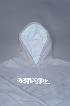 O.G White Nightmare logo hoodie. Our cotton hoodie is lined with versatile white reflective fabric. The reflective logo design features a collection of hands reaching dreams/goals. Perfect for lounging, activewear, events, and meetings. Stay warm, stay fly, you're their worst Nightmare. White Hoodie With Double-lined Hood For Streetwear, Techwear Style White Sweatshirt For Streetwear, White Techwear Hooded Hoodie, White Techwear Hoodie With Drawstring, White Hooded Techwear Sweatshirt, Reflective Fabric, Hoodie Aesthetic, Tactical Clothing, Cotton Hoodie