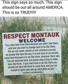 a sign in the sand that says respect montauk welcomes you to another country