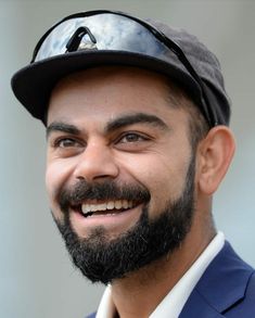 a close up of a person wearing a hat