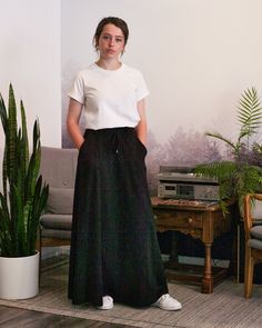 This casual but elegant flared jersey black skirt is perfect for summer. Midweight 100% cotton jersey fabric is ultra comfortable, and the voluminous, flowing design keeps you cool. Features Angled front pockets are lined with rib for breathability and bulk reduction Long side slits for easy walking 5-thread searged and topstitched side seams - for durability and longevity. 3/8" drawcord in black cotton Heavy woven 2" elastic floating waistband Comfortable flare A-line design Designed, cut and s Flow Design, Cotton Jersey Fabric, Keep Your Cool, Black Skirt, Line Design, Flare Skirt, Long Skirt, Jersey Fabric, Black Cotton