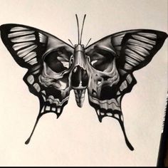 a black and white drawing of a butterfly with skull parts on it's wings