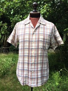 Cool,Casual Summer short sleeved shirt from the 1960s-70s era. I Love the fresh, summery Window Pane Check pattern, woven into the fabric in shades of Blue, Red and Brown. Classic Rockabilly/Bowling shirt styling with open collar, short sleeves and Patch pocket on one Breast. Very good condition, clean and good to go. Made in England. Label Bonart President. Flat Measurements. Chest Total 106cm/41.7 inches Across Shoulders 42cm/16.5 inches CB Length 70cm/27.5 inches 70s Men, 1950s Mens, Gingham Jacket, Seventies Fashion, Bowling Shirt, Checked Jacket, Open Neck, Casual Summer Shorts, Preppy Summer