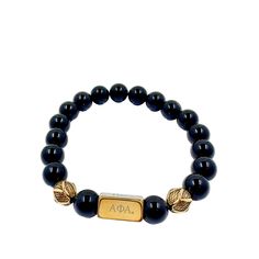 Make a lasting impression with the Alpha Phi Alpha Fraternity Custom Bead Bracelet! Crafted from high-quality Onyx stone and 18K gold plated stainless steel decorative balls, this elegant piece of jewelry is sure to get you noticed. Its tarnish-free and waterproof design makes it durable enough for everyday wear. Plus, it features a beautiful gold plated bar that is engraved with the iconic Alpha Phi Alpha Greek letters — adding the perfect finishing touch to your look. Choose between three uniq Classic Adjustable Jewelry With 8mm Beads, Classic Adjustable 8mm Beads Jewelry, Luxury Gold Beaded Bracelets For Gift, Classic Hand-strung Stretch Bracelet Gift, Elegant Personalized Stretch Bracelet With Round Beads, Elegant Adjustable Name Bracelet With Round Beads, Elegant Personalized Black Name Bracelet, Elegant Black Personalized Name Bracelet, Elegant Personalized Stretch Bracelet Gift