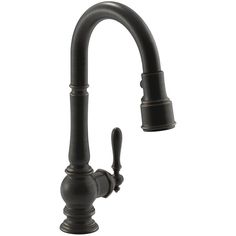 a black kitchen faucet with two handles and nozzles on the side