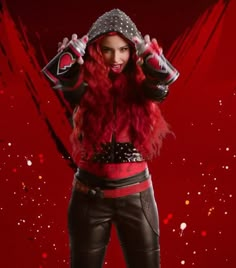 a woman with red hair wearing black leather pants